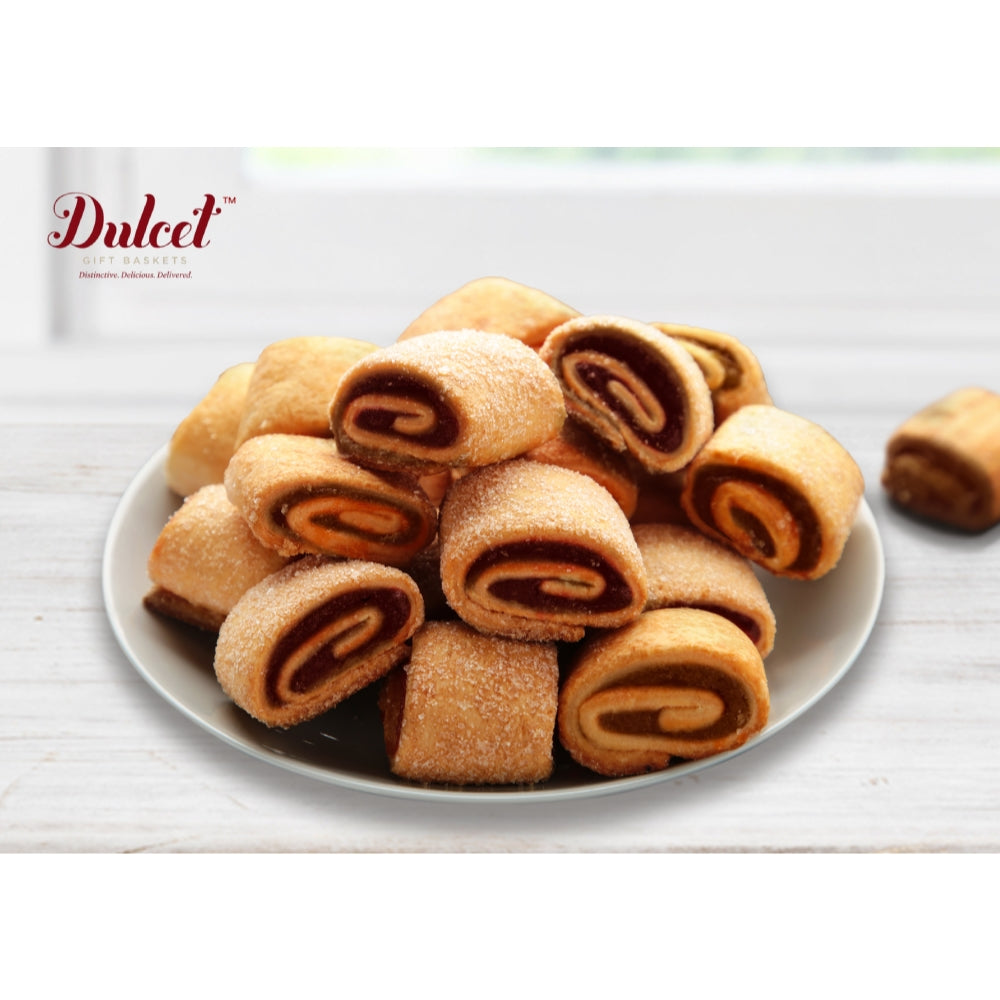 Roll cookies on a white plate with 'Dulceet' branding in the background.