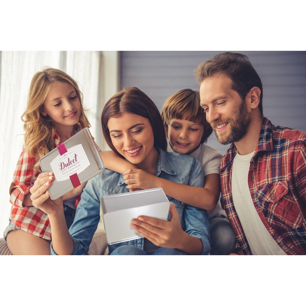 Family of four looking at a tablet together in a home setting
