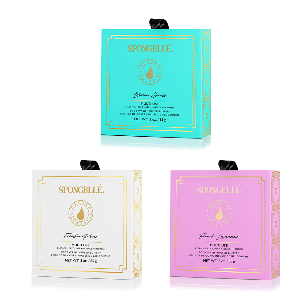 Three Spongellé product boxes in turquoise, white, and pink on a white background