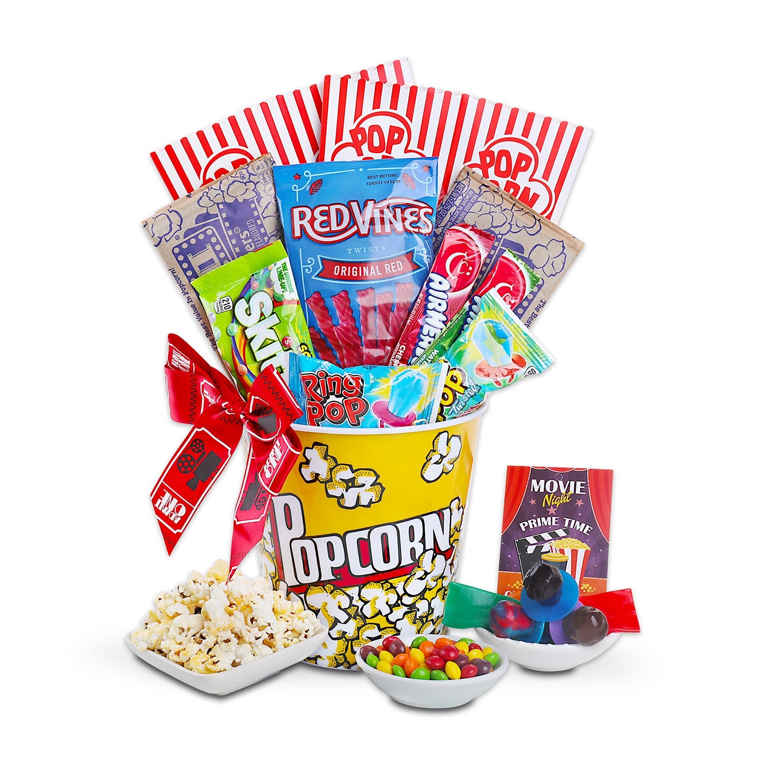 Movie night gift basket with popcorn bucket, candy, and snacks on a white background