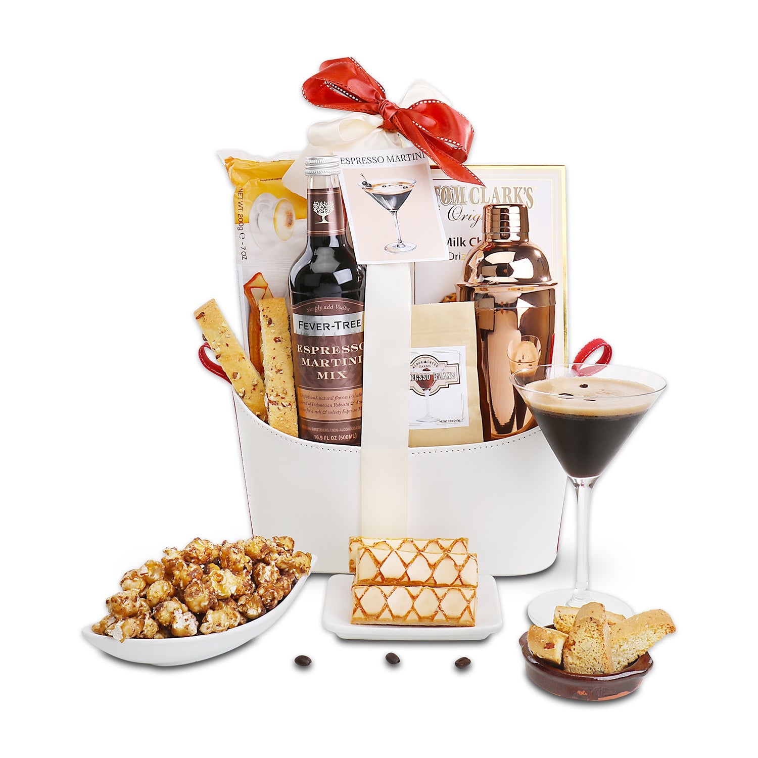 Gift basket with Fever-Tree Ale, popcorn, and a cocktail glass on a white background