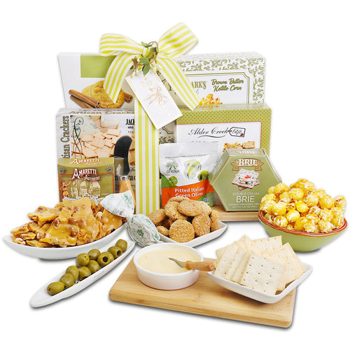 Gourmet gift basket with snacks and crackers on a white background