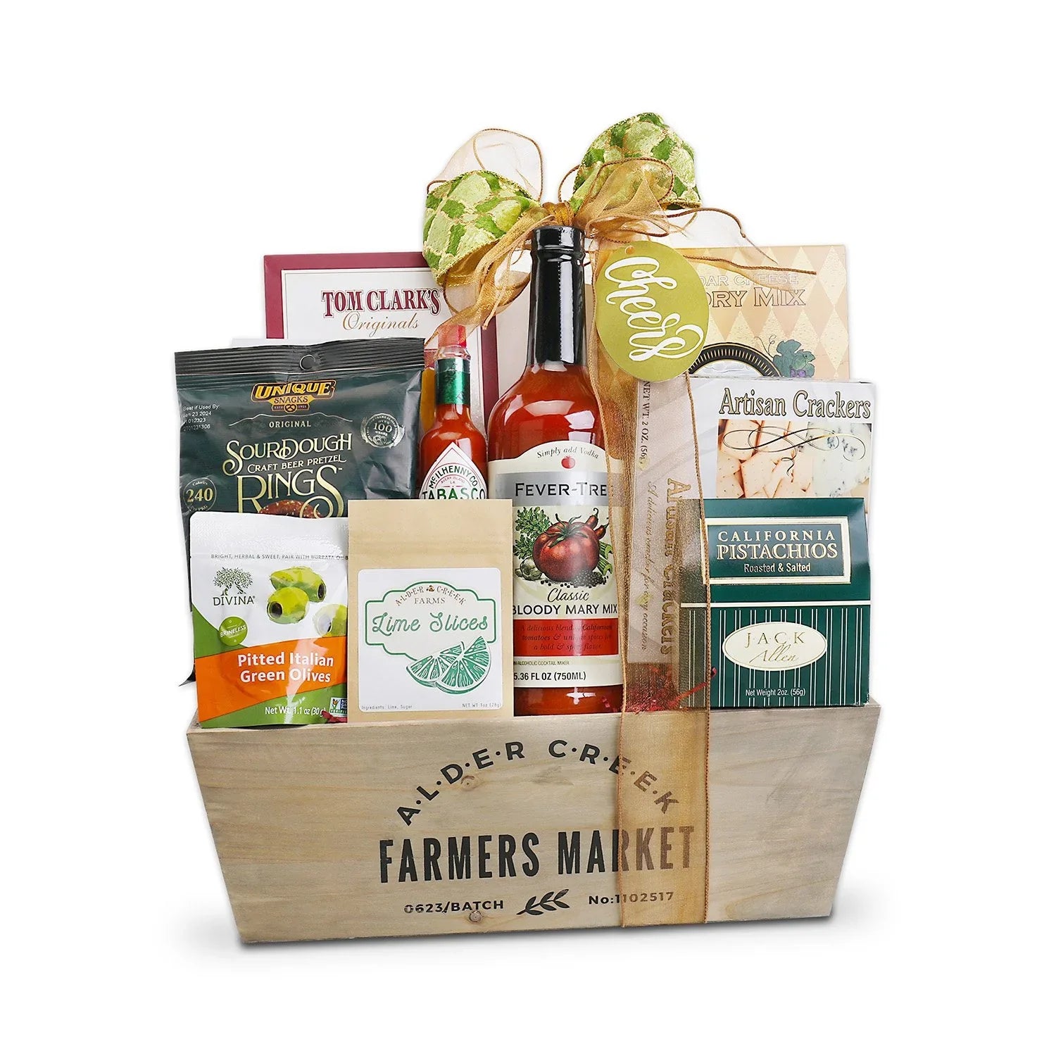 Gift basket from Alder Creek Farmers Market with various items including a bottle of hot sauce and a box of crackers.