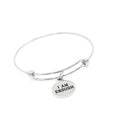 Silver bracelet with 'I AM ENOUGH' charm on a white background